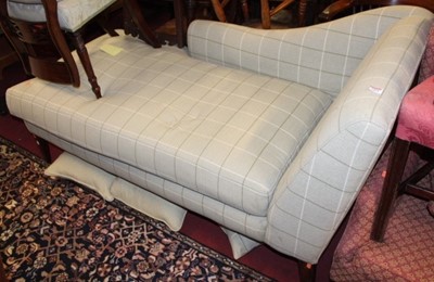 Lot 1454 - A contemporary upholstered daybed, raised on...