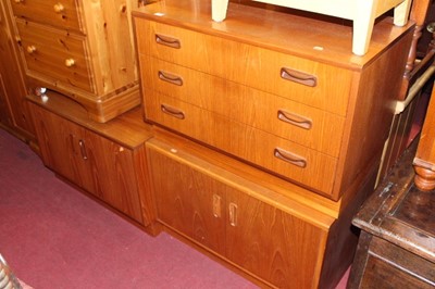 Lot 1458 - A 1960s G-Plan teak low chest of three long...