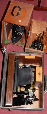 Lot 1472 - A cased Singer sewing machine; together with...