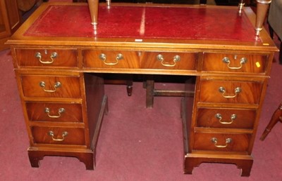 Lot 1475 - A reproduction mahogany and gilt tooled red...