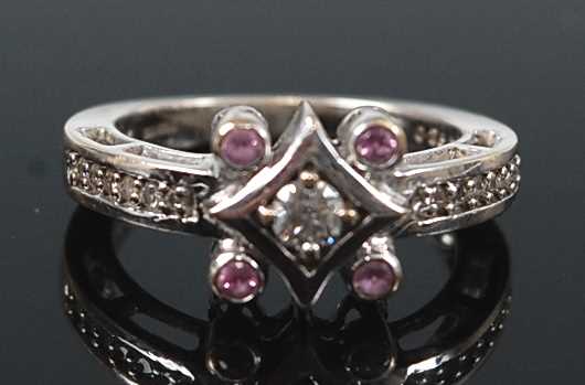 Lot 2634 - An 18ct white gold, diamond and pink sapphire...