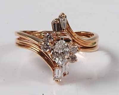 Lot 2635 - A yellow metal diamond marquise shaped cluster...
