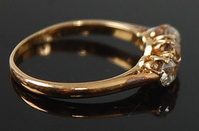 Lot 2637 - A yellow metal diamond three-stone ring,...