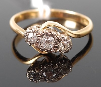Lot 361 - A yellow diamond three stone dress ring, the...