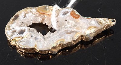 Lot 373 - A polished and sliced agate section, in gilt...