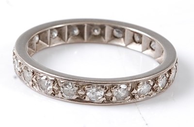 Lot 2674 - A white metal diamond full hoop eternity ring...