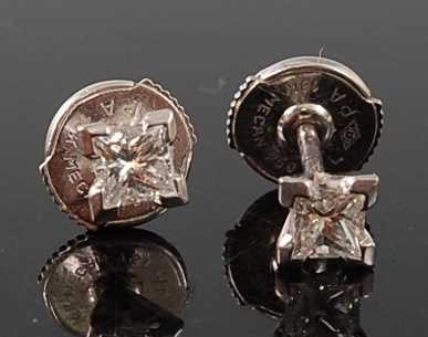 Lot 2680 - A pair of white metal diamond single stone...