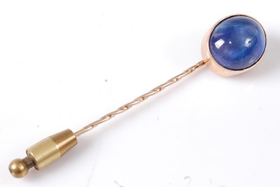 Lot 2707 - A yellow metal sapphire stick pin, featuring...