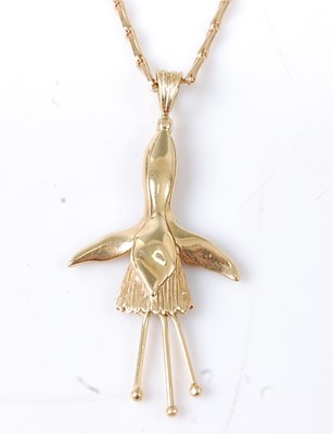 Lot 2734 - An 18ct yellow gold fuchsia pendant, with...