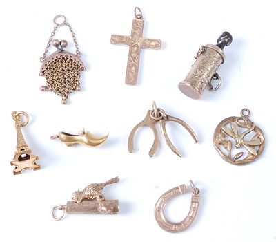 Lot 2737 - An assortment of charms, comprising a 9ct...