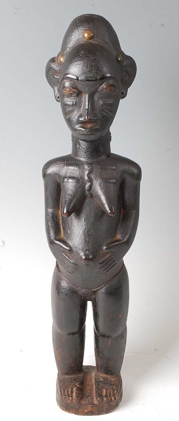 Lot 212 - * A female ancestor figure, with libations of...
