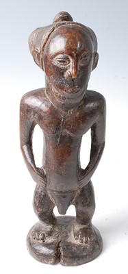 Lot 87 - * A male ancestor figure in standing pose,...