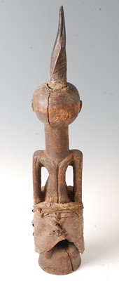 Lot 89 - * A male Power or fetish figure in standing...