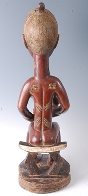 Lot 218 - * A large maternity figure carved as a female...