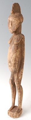 Lot 61 - * An ancestor figure, carved as a man in...