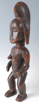 Lot 73 - * An ancestor figure, carved as a nude female...
