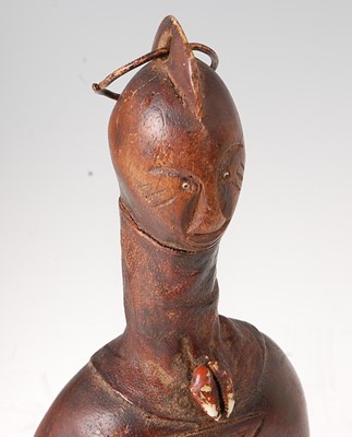 Lot 77 - * A fetish type fertility figure, mounted with...