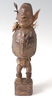 Lot 100 - * A Nkisi Power fetish figure, having a carved...