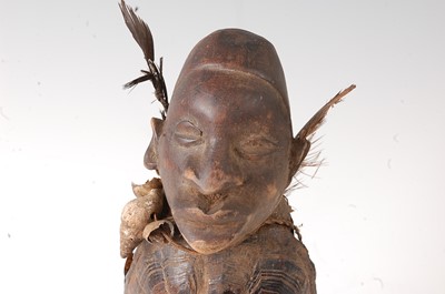 Lot 100 - * A Nkisi Power fetish figure, having a carved...