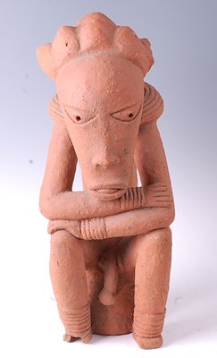 Lot 214 - * A large terracotta figure of a seated male...
