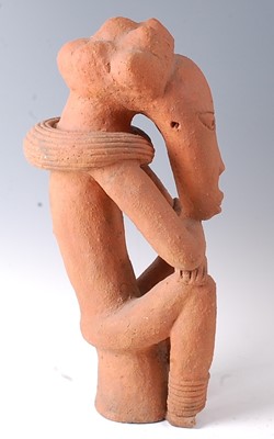 Lot 214 - * A large terracotta figure of a seated male...