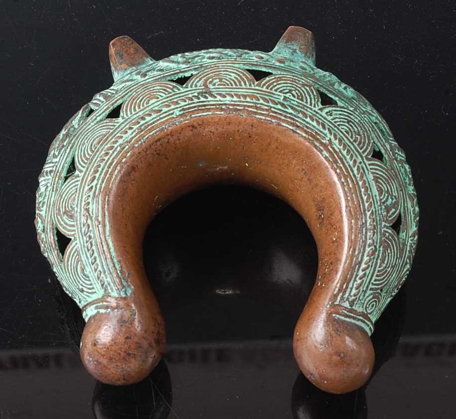 Lot 174 - * A cast copper currency bracelet, having...