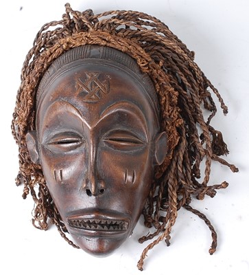 Lot 104 - * A carved wooden initiation mask, having...