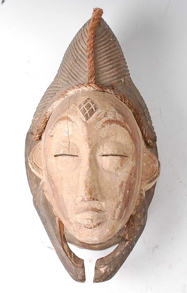 Lot 105 - * A carved wooden initiation or spirit mask,...