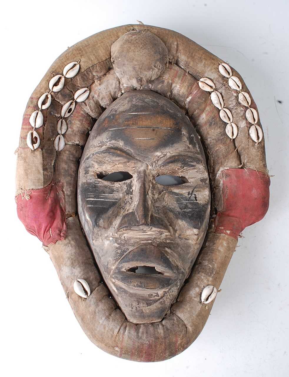 Lot 106 - * An initiation mask, in original padded...