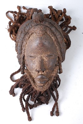Lot 107 - * A carved wooden dance mask, having original...