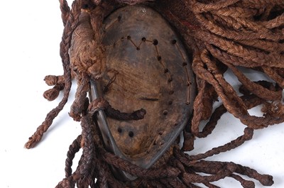 Lot 107 - * A carved wooden dance mask, having original...