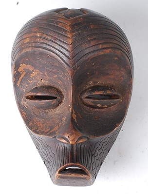 Lot 110 - * A carved wooden dance / initiation mask,...