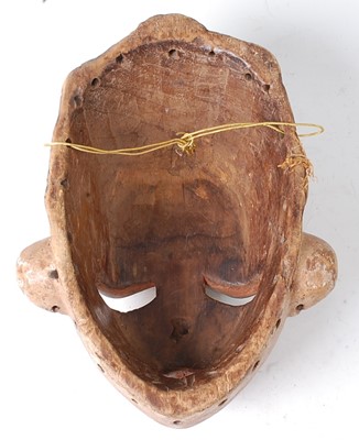 Lot 111 - * A carved wooden ritual mask, with polychrome...
