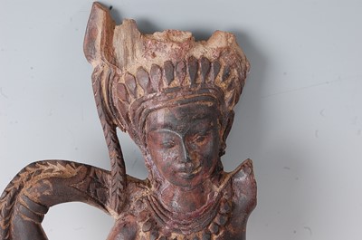 Lot 232 - * A carved wooden spirit figure, having traces...