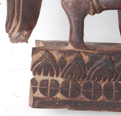 Lot 232 - * A carved wooden spirit figure, having traces...