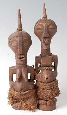 Lot 119 - * A pair of wooden fetish figures, carved as a...