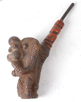 Lot 120 - * A large clay smoking pipe, the bowl in the...