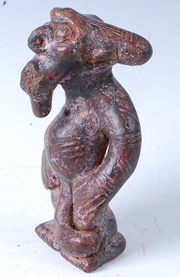Lot 123 - * A terracotta zoomorphic figure, in standing...