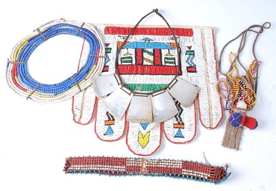 Lot 128 - * A leather apron with applied beadwork...