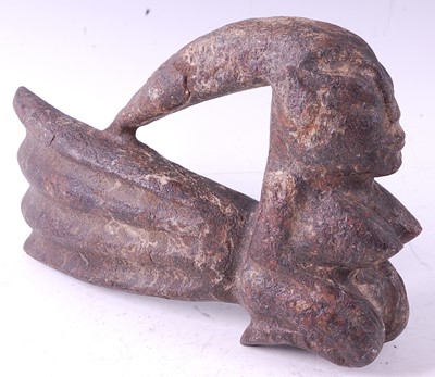Lot 129 - * A stone ritual figure, carved as a female in...