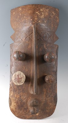 Lot 131 - * A large carved wooden helmet mask, with...