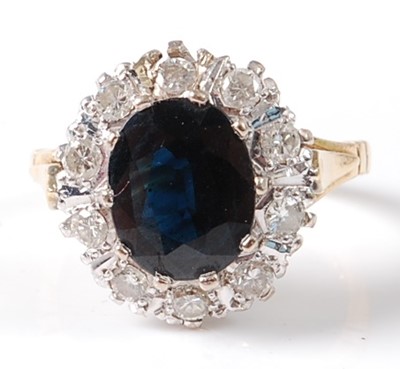 Lot 2774 - An 18ct yellow and white gold sapphire and...