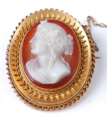 Lot 2776 - A yellow metal oval carved shell cameo brooch...