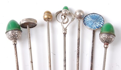 Lot 2781 - Seven assorted white metal hat pins to include...
