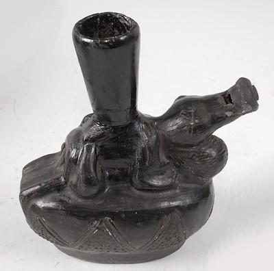 Lot 333 - * A black burnished terracotta stirrup vessel,...