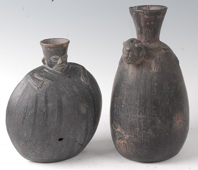 Lot 338 - * A Huaco black-ware vessel of compressed...