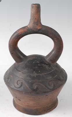 Lot 346 - * A pottery stirrup vessel, modelled as a male...