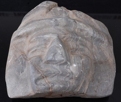 Lot 340 - * A carved stone face mask, h.15cm, together...