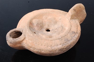 Lot 397 - * A Greco-Roman pottery oil lamp, w.12cm,...