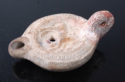 Lot 397 - * A Greco-Roman pottery oil lamp, w.12cm,...
